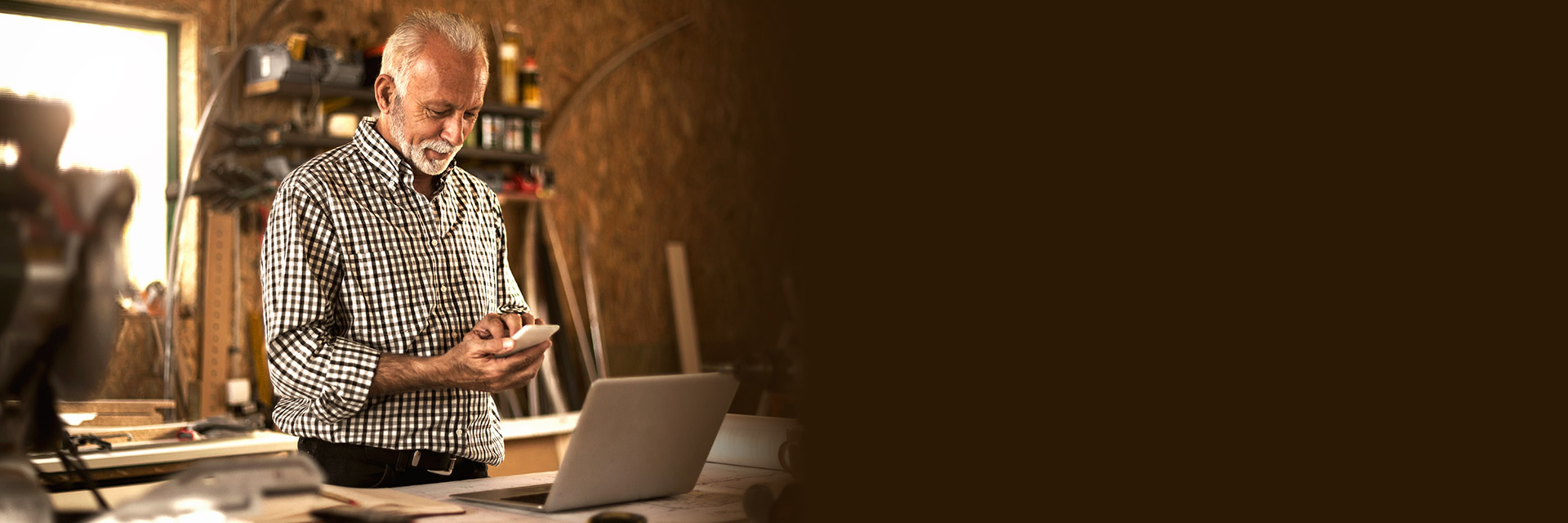 Man on phone in wood shop