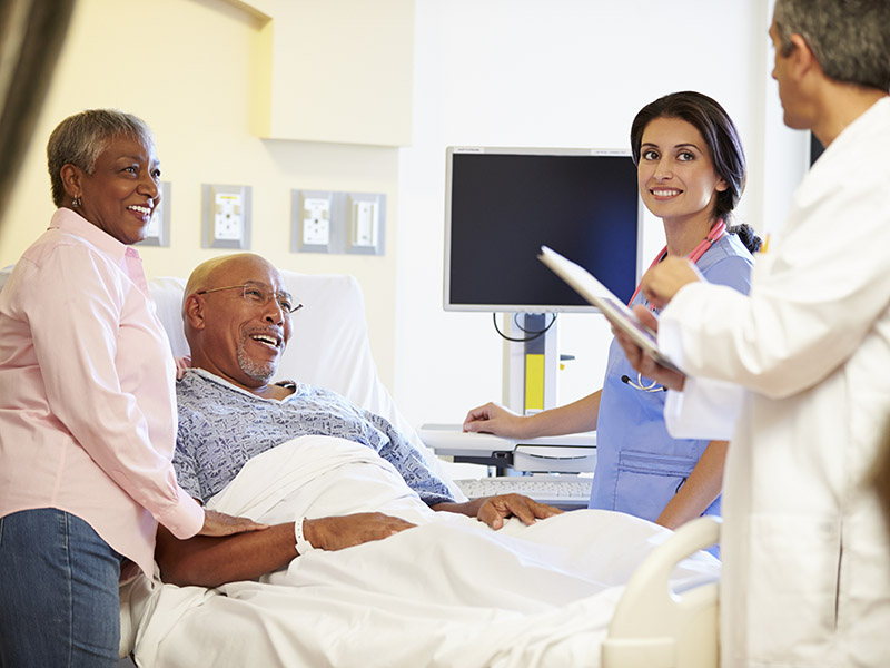 Couple Talking to Medical Team