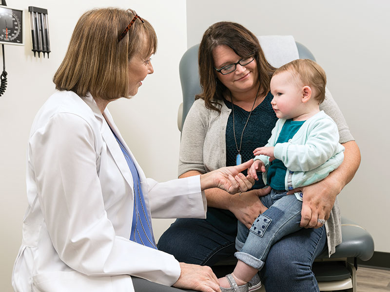 Doctor with Mom and Baby