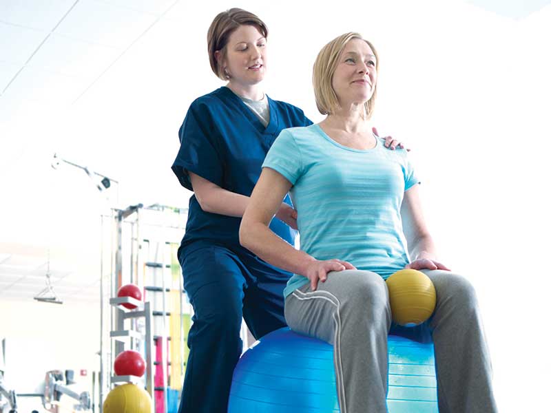 Physical therapist with patient